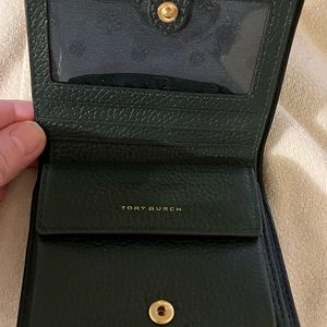 Tory Burch, a bifold wallet in navy blue